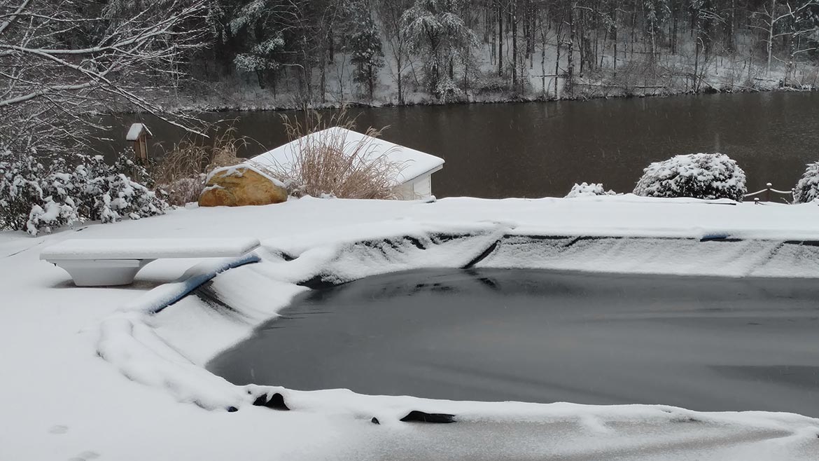 Old pool cover in the snow
